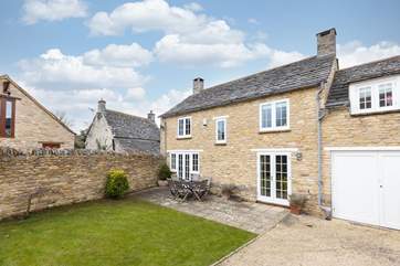 To the rear of the cottage, the enclosed garden and private parking; it is easier to reverse through the gates, as the turning circle is quite tight.