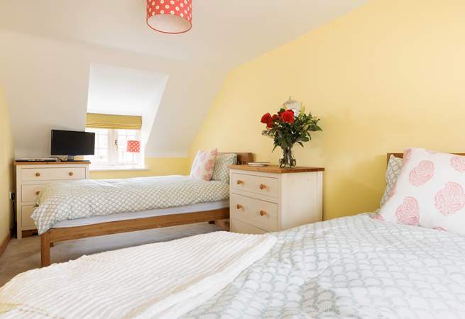 The bright twin room will delight adults and children alike.