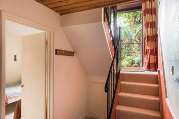 The split level house has the living space on the first floor, and bedrooms on the ground floor.