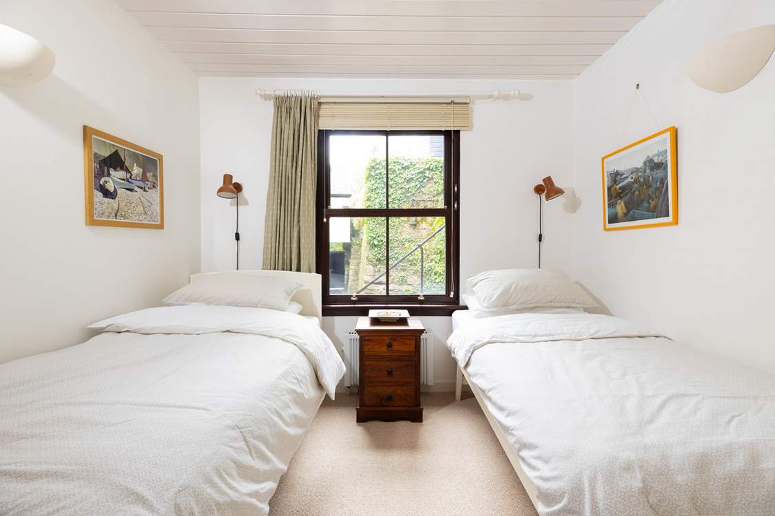 The cosy twin bedroom is tucked away for peace and quiet.