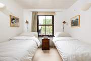 The cosy twin bedroom is tucked away for peace and quiet.