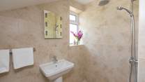 The en suite wet-room is down a couple of steps from the main bedroom.