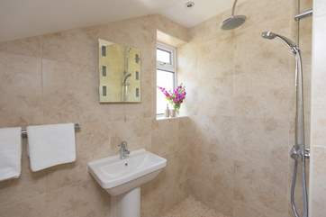 The en suite wet-room is down a couple of steps from the main bedroom.