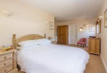 The main bedroom has plenty of space and a luxurious king-size bed.