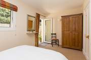 There is a door to the patio so you can lie in bed, and let the fresh morning air and the sound of birdsong in.