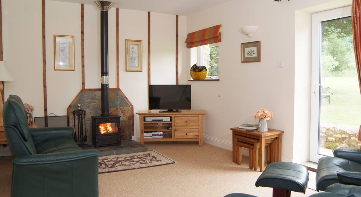 The living-room has a choice of wonderfully comfortable reclining chairs, with a wood-burning stove for out-of-season evenings.