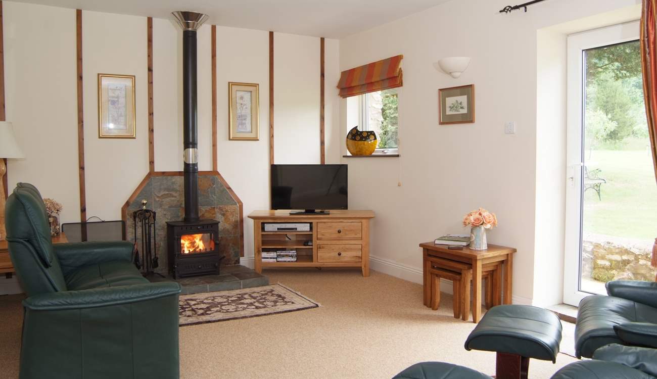 The living-room has a choice of wonderfully comfortable reclining chairs, with a wood-burning stove for out-of-season evenings.