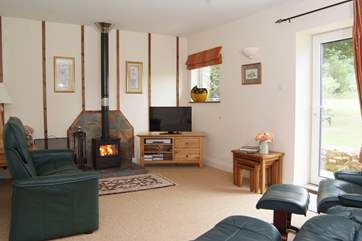 The living-room has a choice of wonderfully comfortable reclining chairs, with a wood-burning stove for out-of-season evenings.