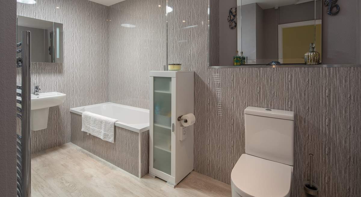 A super spacious and modern bathroom awaits. Perfect for unwinding in after a full day of adventure.