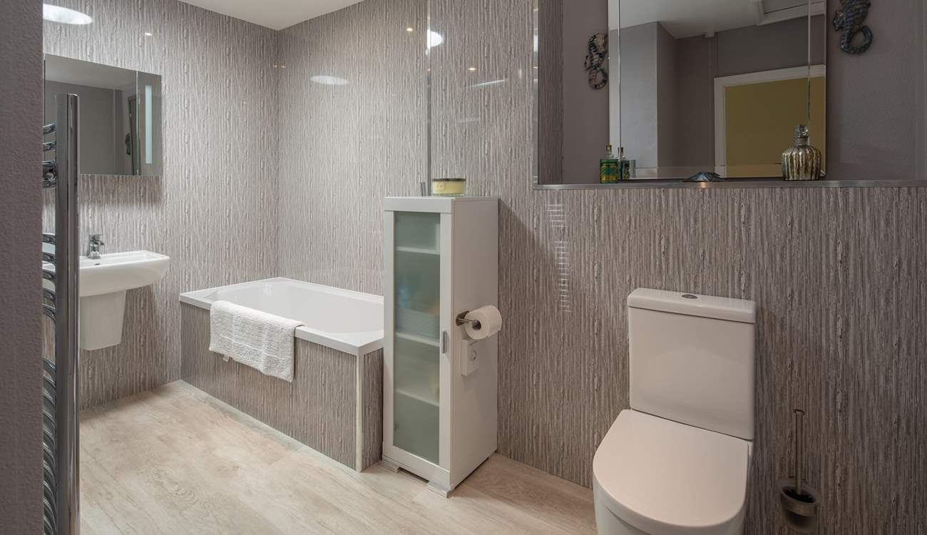 A super spacious and modern bathroom awaits. Perfect for unwinding in after a full day of adventure.