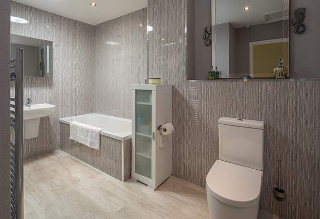 A super spacious and modern bathroom awaits. Perfect for unwinding in after a full day of adventure.