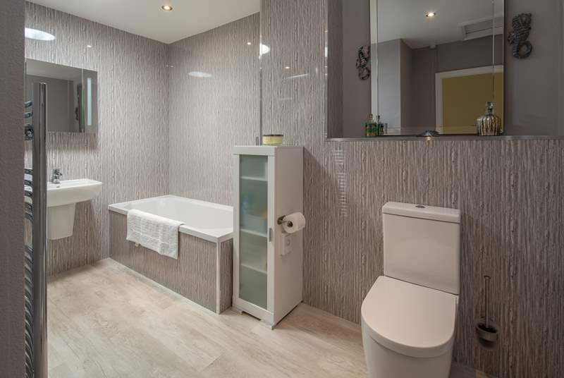 A super spacious and modern bathroom awaits. Perfect for unwinding in after a full day of adventure.