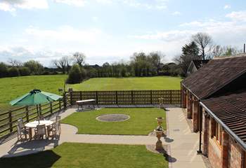 The enclosed garden looks out over Cherry May Farm's fields.