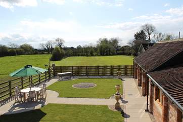The enclosed garden looks out over Cherry May Farm's fields.