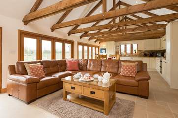 Looking down the length of the open plan interior. There is so much space here and at the same time it is warmly welcoming.