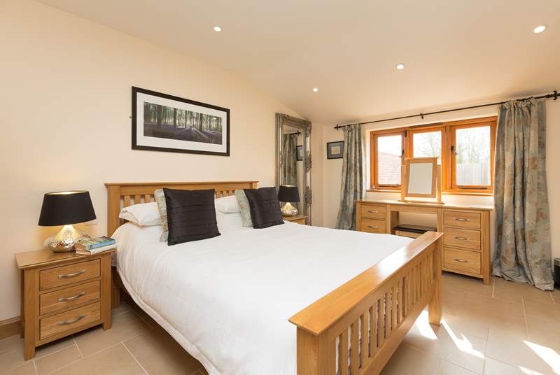 This is the large master bedroom with its king-sized bed and luxurious en suite bathroom.