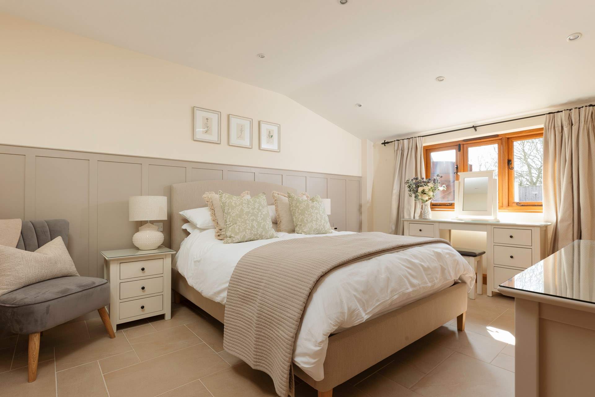 This is the large master bedroom with its king-sized bed and luxurious en suite bathroom.