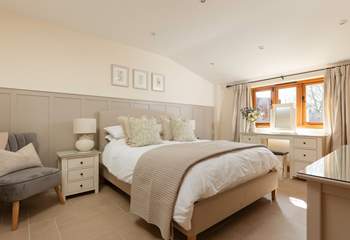 This is the large master bedroom with its king-sized bed and luxurious en suite bathroom.