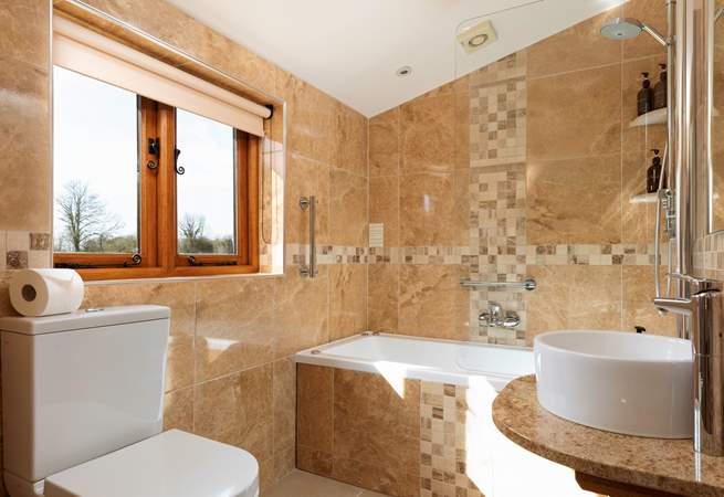 The en-suite bathroom is just off Bedroom 1.