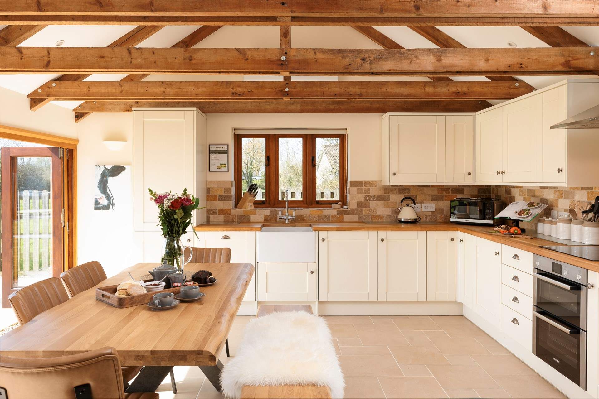 The kitchen is fitted around two walls at the far end of the ground floor. It is superbly equipped for you.