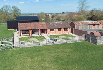 This aerial view shows The Old Barn, sauna and hot tub area to the far right hand side and Dutch barn to the rear where there is parking for guests.
