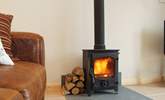 The little wood-burner provides a warming focal point. - Thumbnail Image