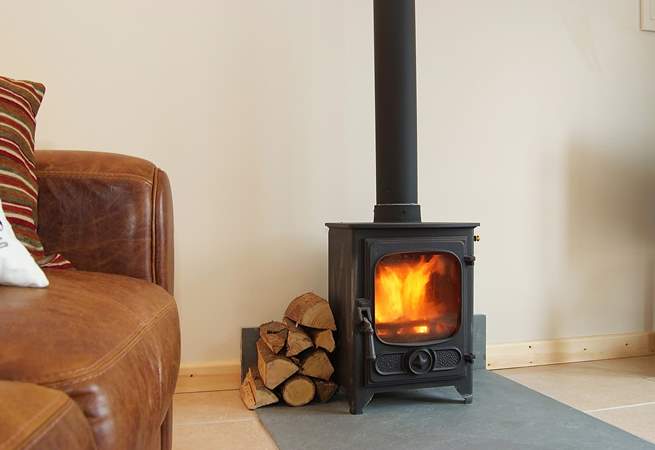 The little wood-burner provides a warming focal point.