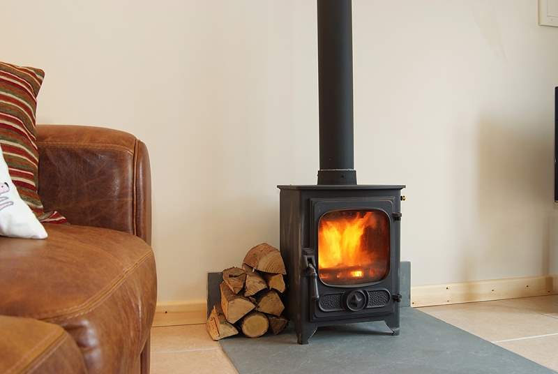 The little wood-burner provides a warming focal point.