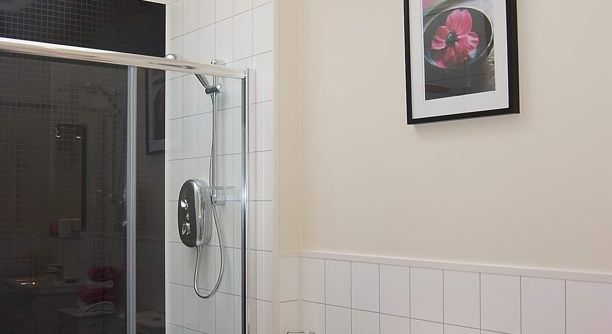 A Velux window above the double shower cubicle allows light to flood in.