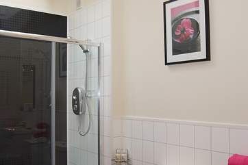 A Velux window above the double shower cubicle allows light to flood in.