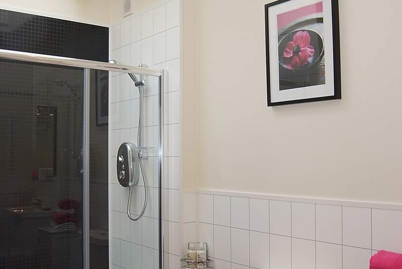 A Velux window above the double shower cubicle allows light to flood in.