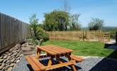 The small enclosed garden has lovely rural views. - Thumbnail Image