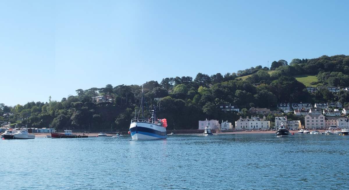 Boats coming into the estuary from the open sea.