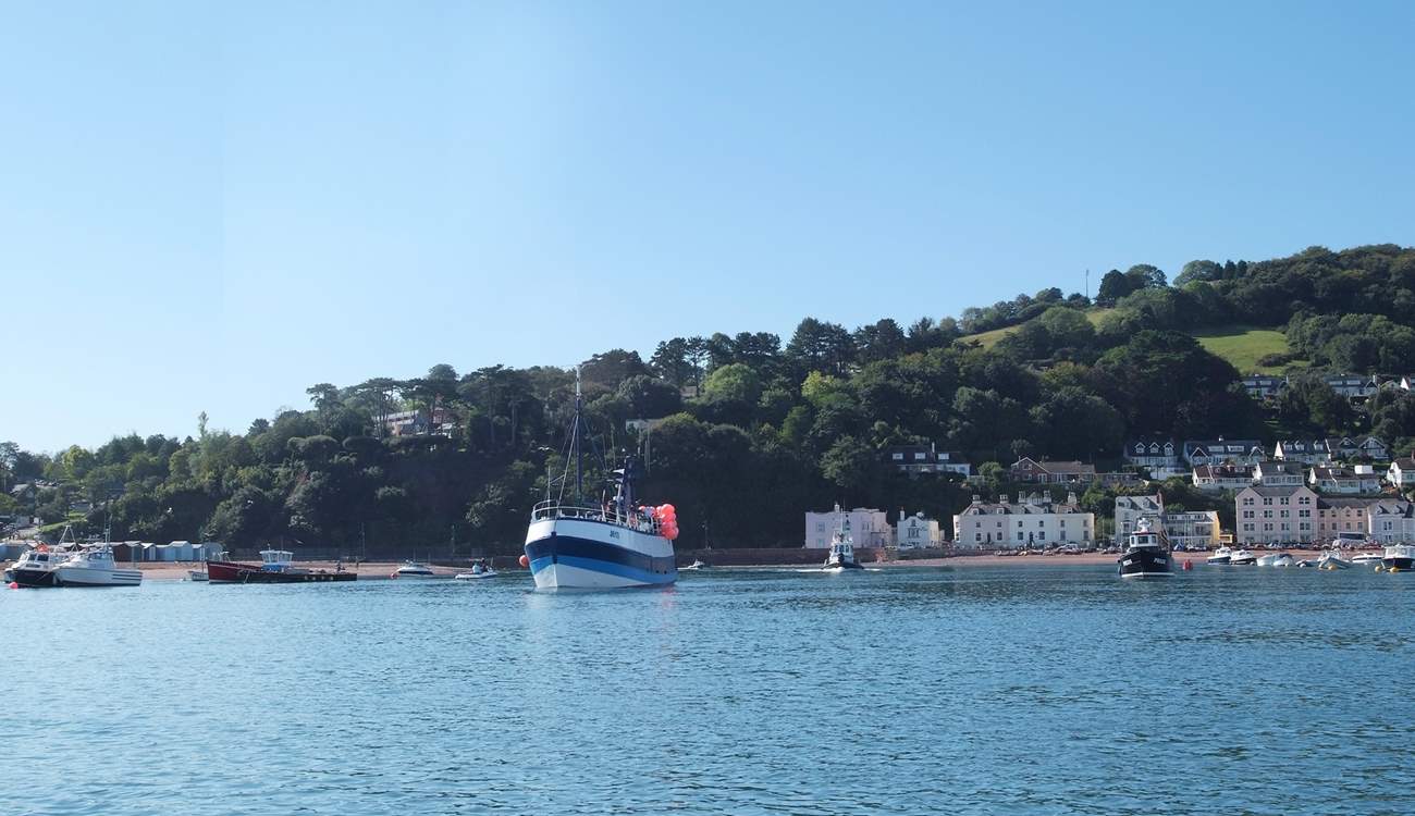 Boats coming into the estuary from the open sea.