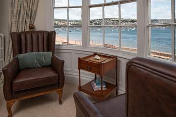 Hours could be spent in these comfy chairs watching the world pass by right outside your window.