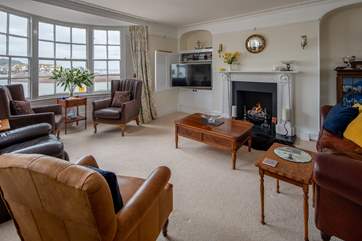 The sitting-room offers super comfy seating for the whole party.