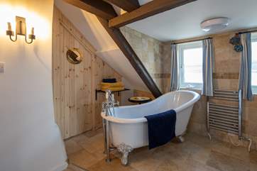 Beautiful roll-top bath in bedroom three's en-suite.