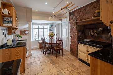 Such a lovely kitchen area with a fabulous dining-table to feast together at.