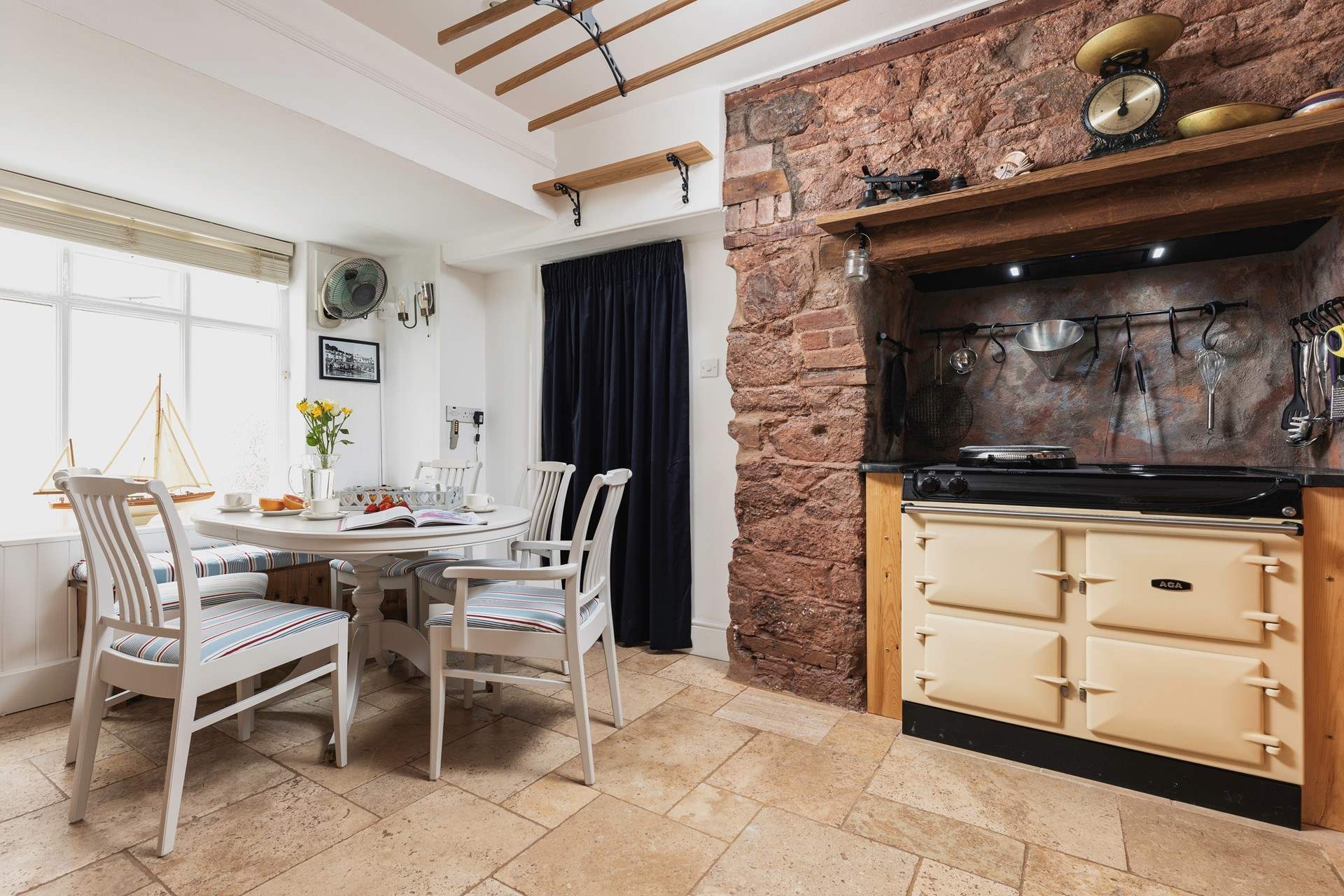 Such a lovely kitchen area with a fabulous dining-table to feast together at.