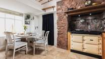 Such a lovely kitchen area with a fabulous dining-table to feast together at.