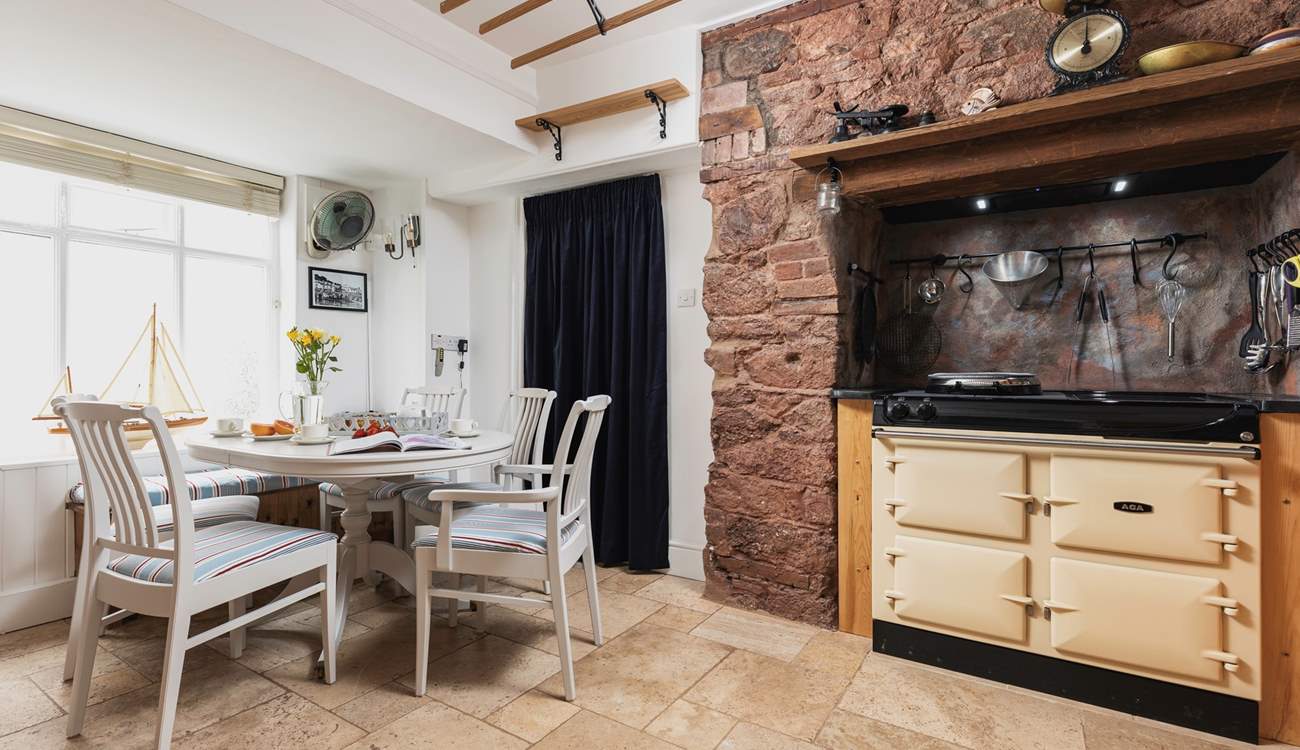 Such a lovely kitchen area with a fabulous dining-table to feast together at.
