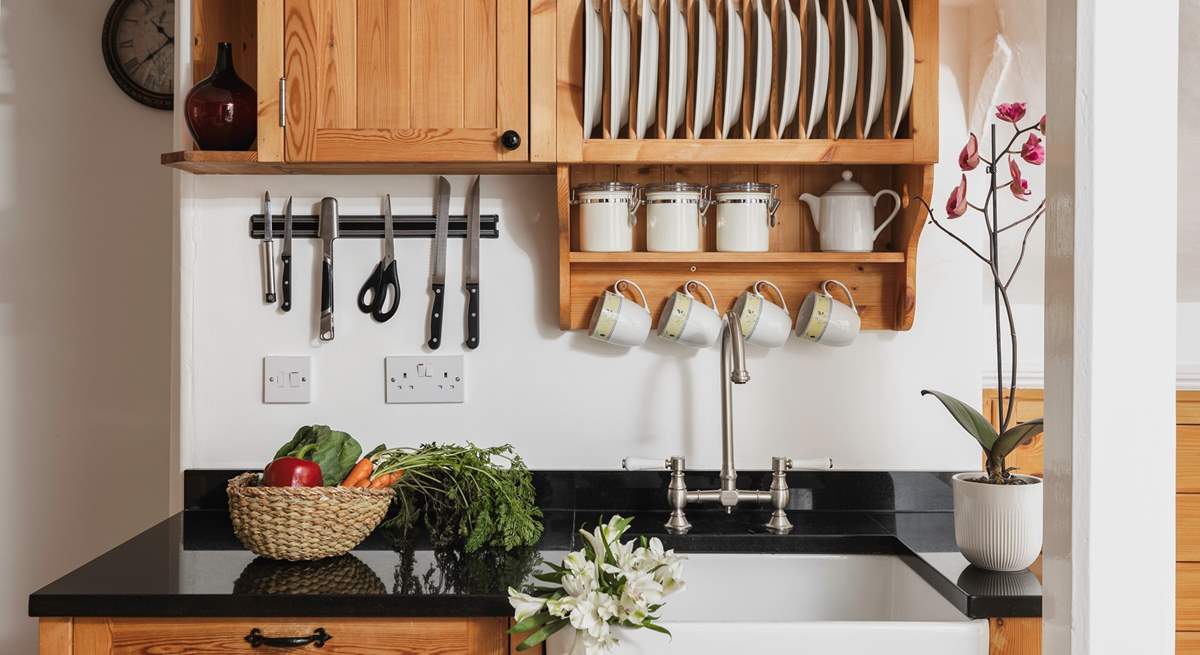 The characterful kitchen is equipped with everything you will need. 