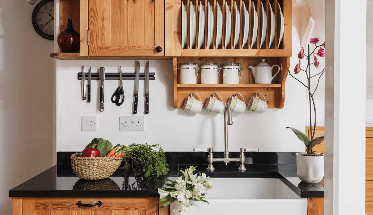 The characterful kitchen is equipped with everything you will need. 