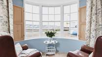 Watch the water world go by from the bay window.