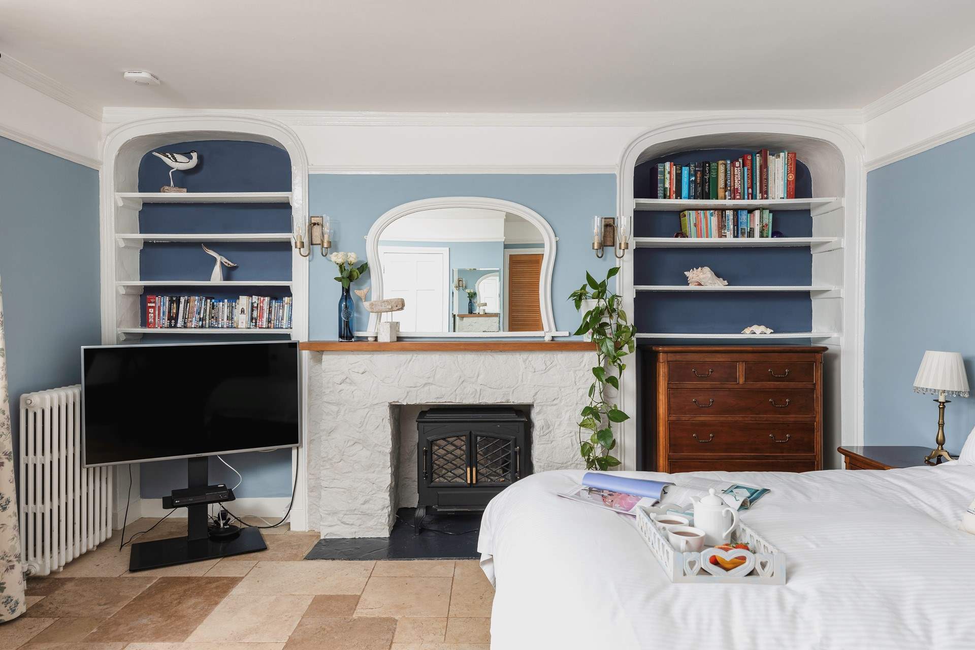 The coal-effect electric fire will keep you cosy throughout the year.