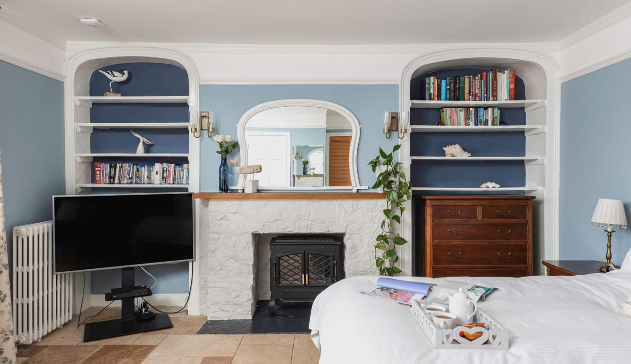 The coal-effect electric fire will keep you cosy throughout the year.