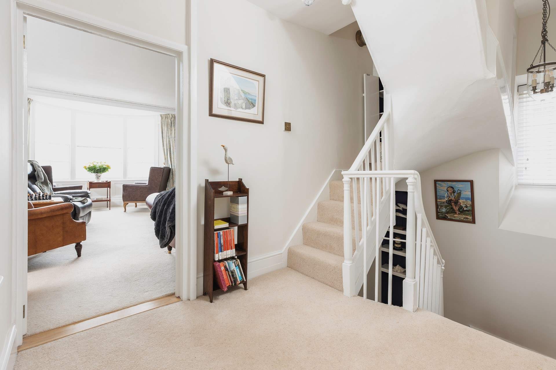 Stairs lead from the ground floor to the first floor sitting-room, bedroom 2 and the family bathroom.