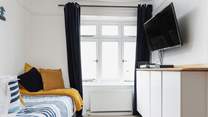Bedroom 2 has a single bed and 'pod' bunk beds.