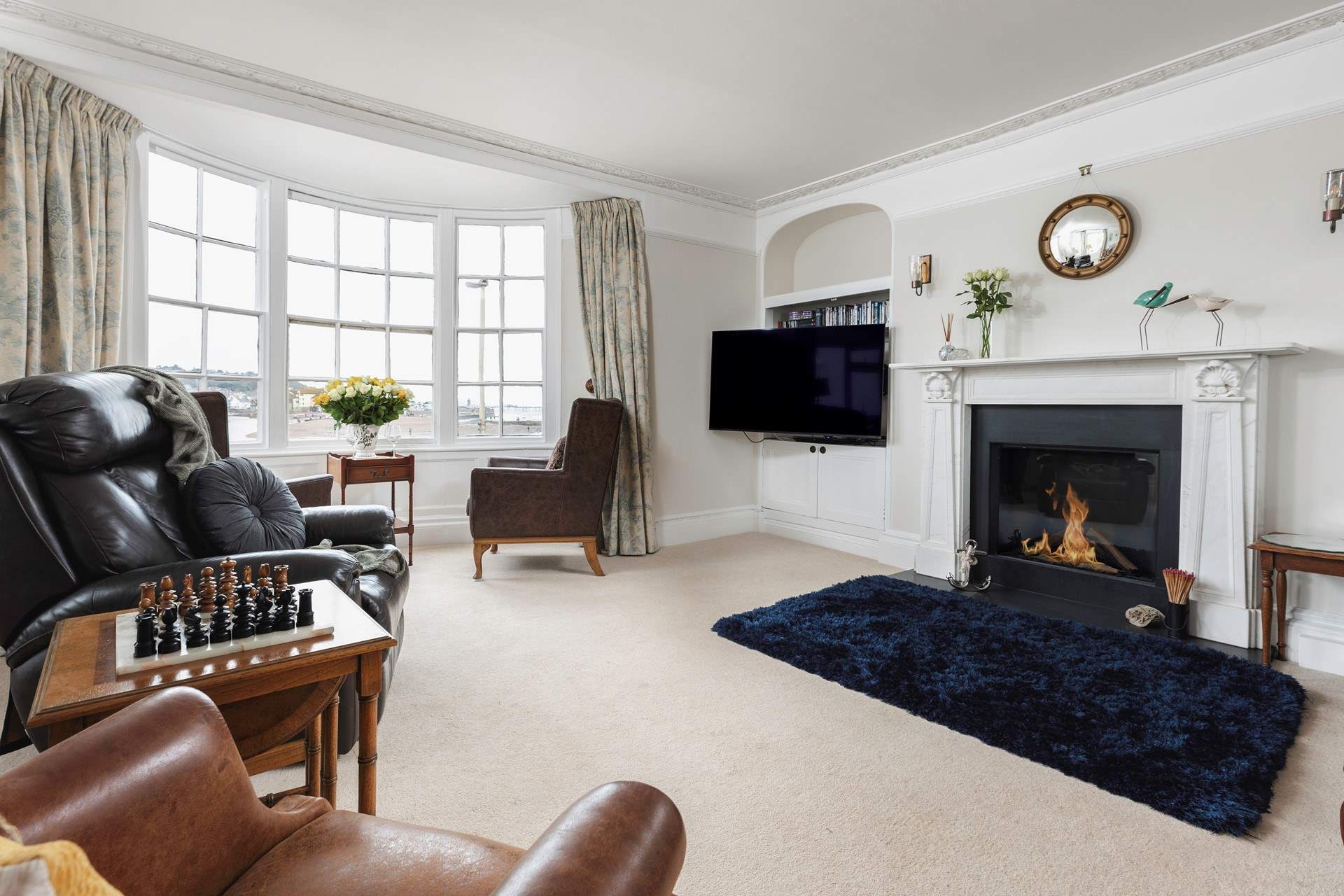 The gorgeous sitting-room on the first floor has views of the beach and bay.
