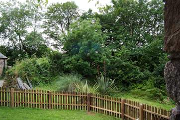 The garden is entirely fenced and you can just see the entrance drive on the left.